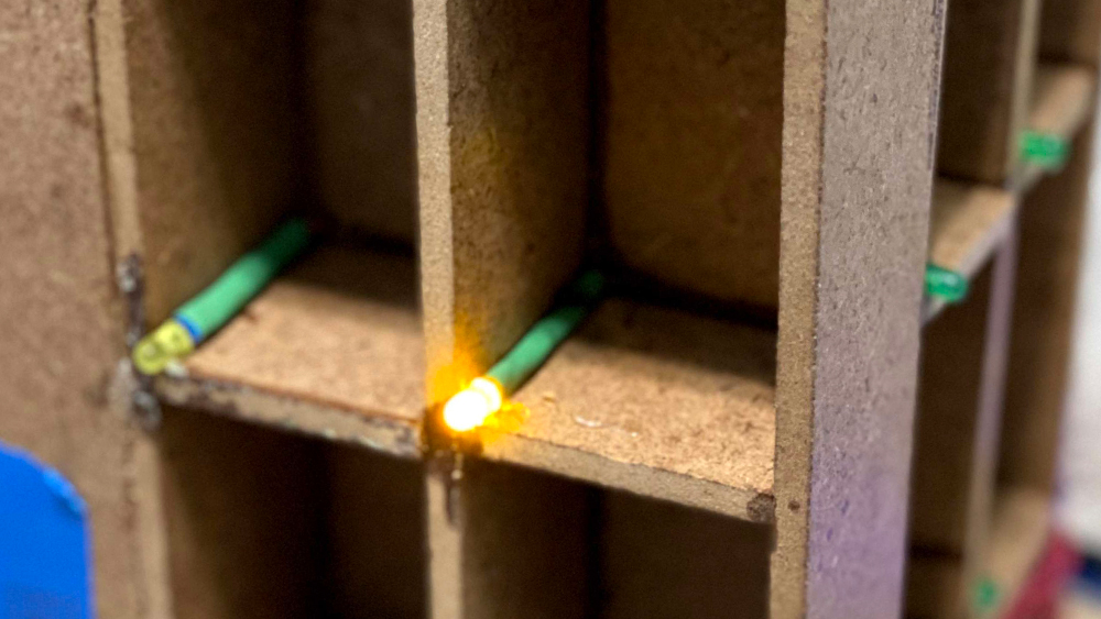 An LED light shines inside one of the 16 Cubicool slots.