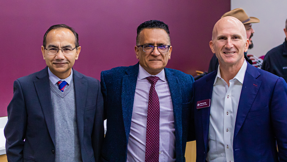 Ben Keating (right) stands with Dr. Bimal Nepal (left), associate director of the undergraduate program in industrial distribution, and Dr. Reza Langari (middle), department head of the Department of Engineering Technology and Industrial Distribution.