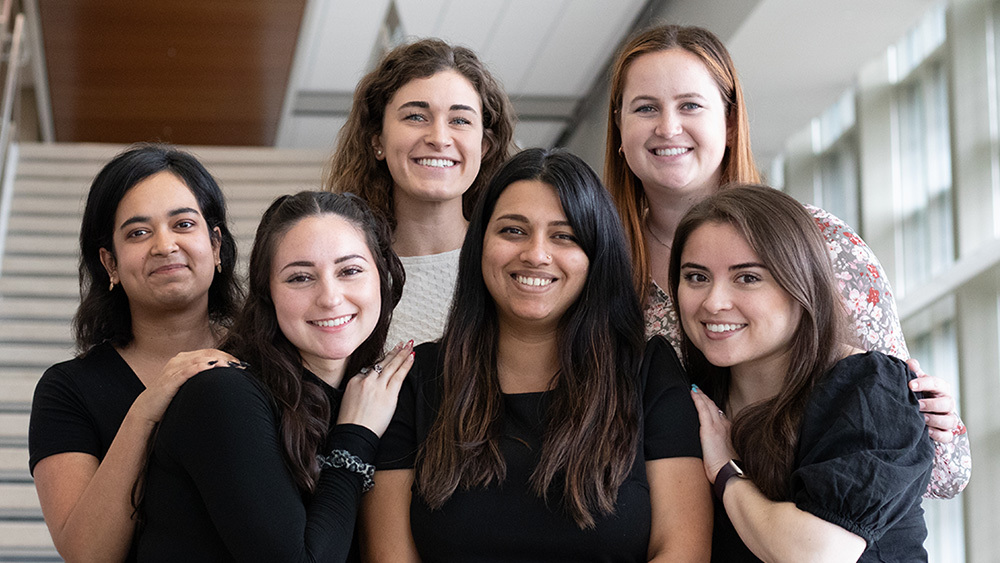 Dr. Shreya Raghavan and a group of graduate students.