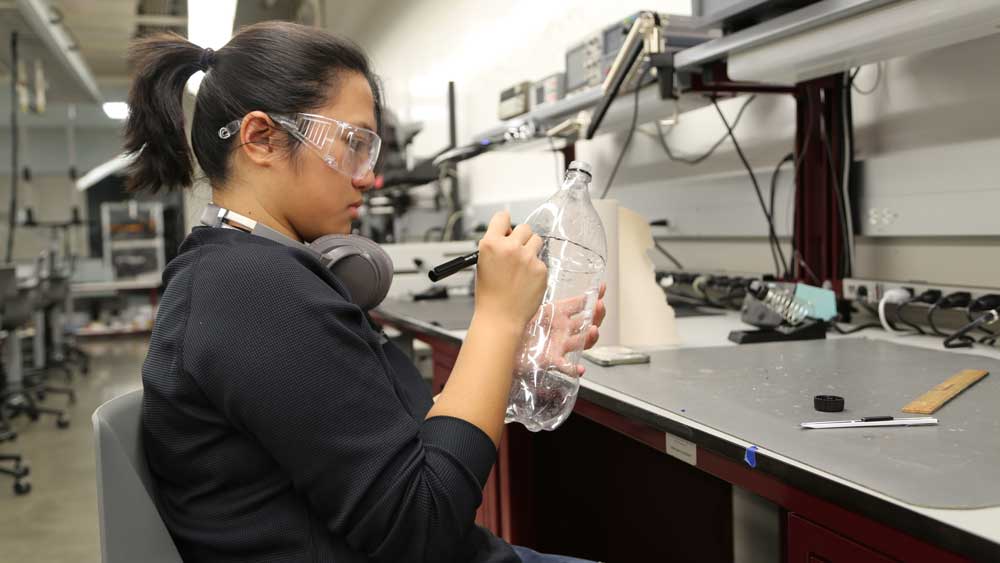 Student working on water bottle prototype design in the SuSu and Mark A. Fischer '72 Engineering Design Center.