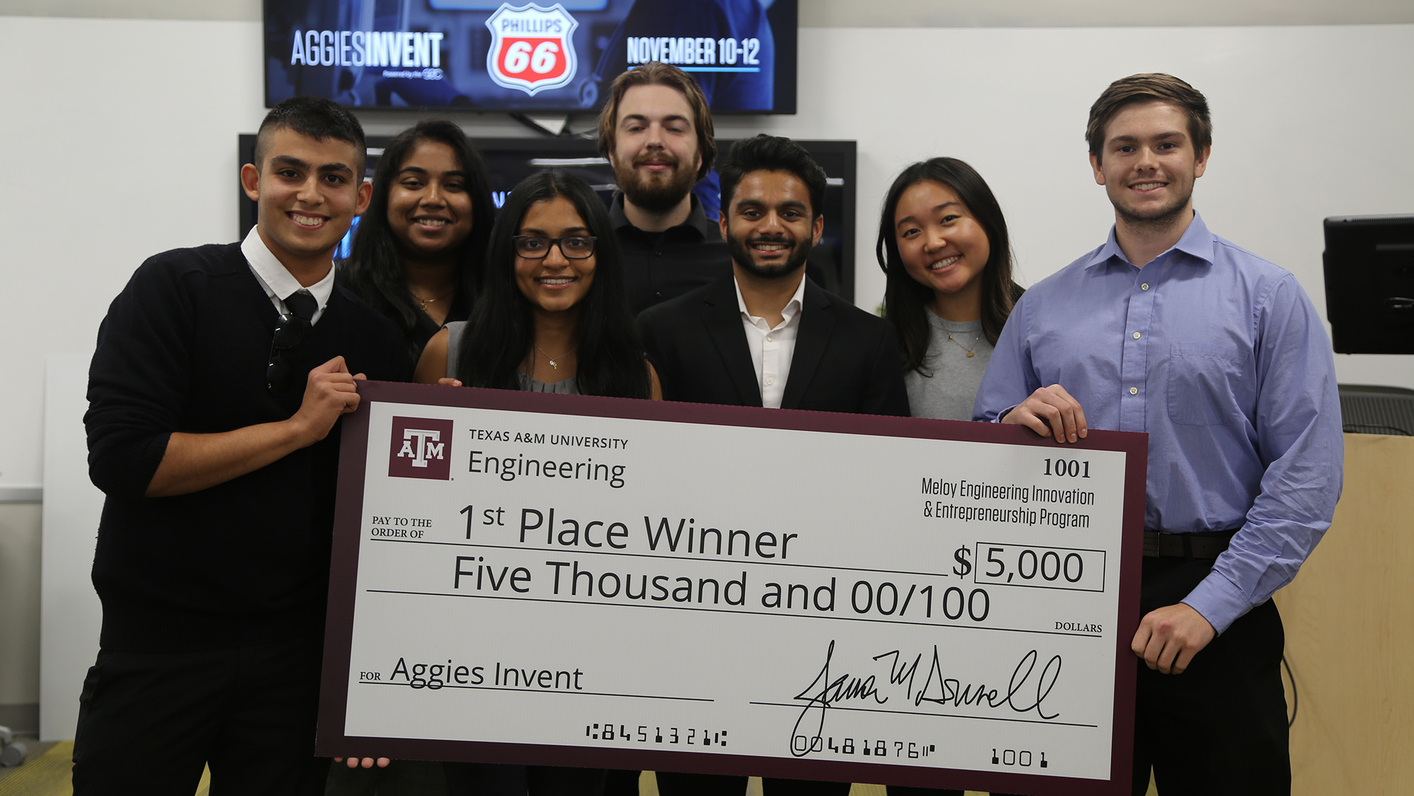 Team Ray-Bans holding their large first-place check for $5,000.