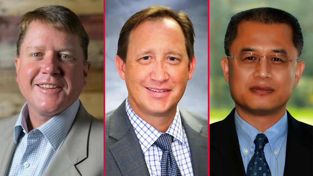 three men smiling and wearing business attire