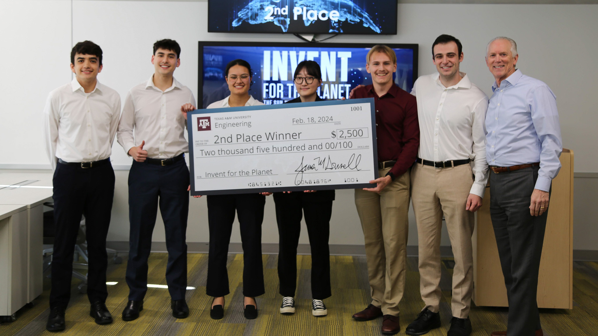 Team Gulf Gliders being presented a jumbo check for second place with a prize of $2,500.