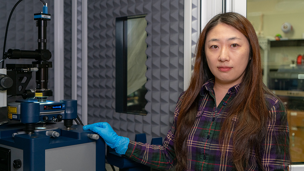 Image of Dr. Yuxiao Zhou in a lab.   