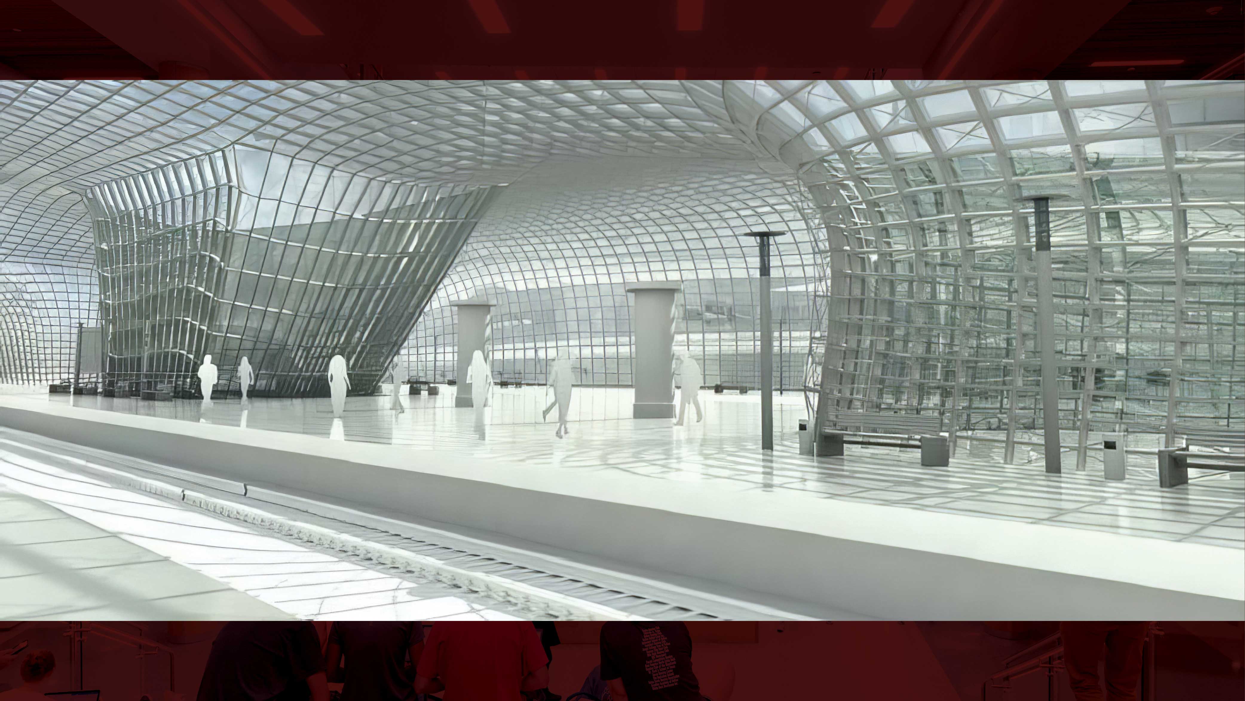 A model of a railway station with a glass ceiling and glass columns in shades of white and gray. Railway tracks are in the foreground, and there is a platform with models of passengers walking in the background. There are stone columns and lampposts alongside the railway tracks.