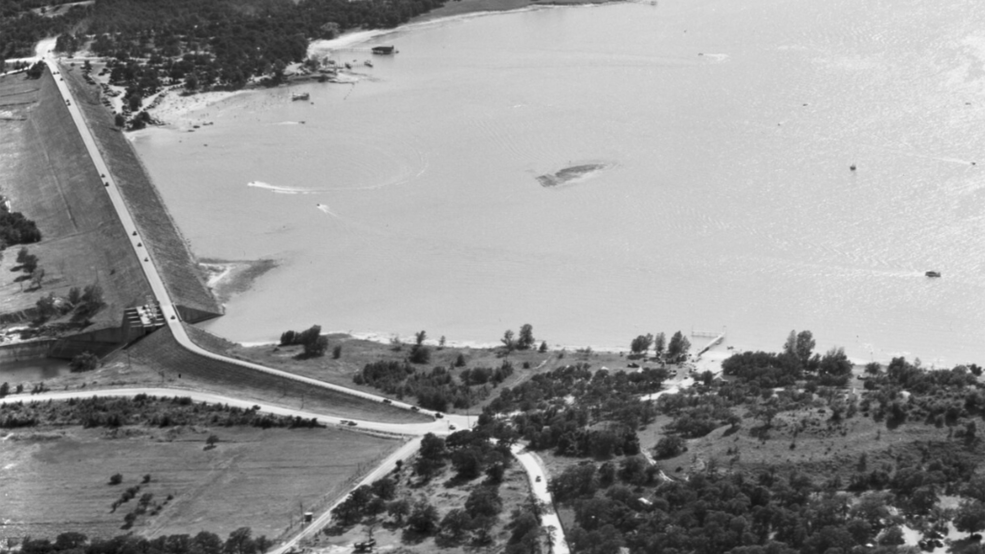 An aerial view of Eagle Lake dam in black and white. 