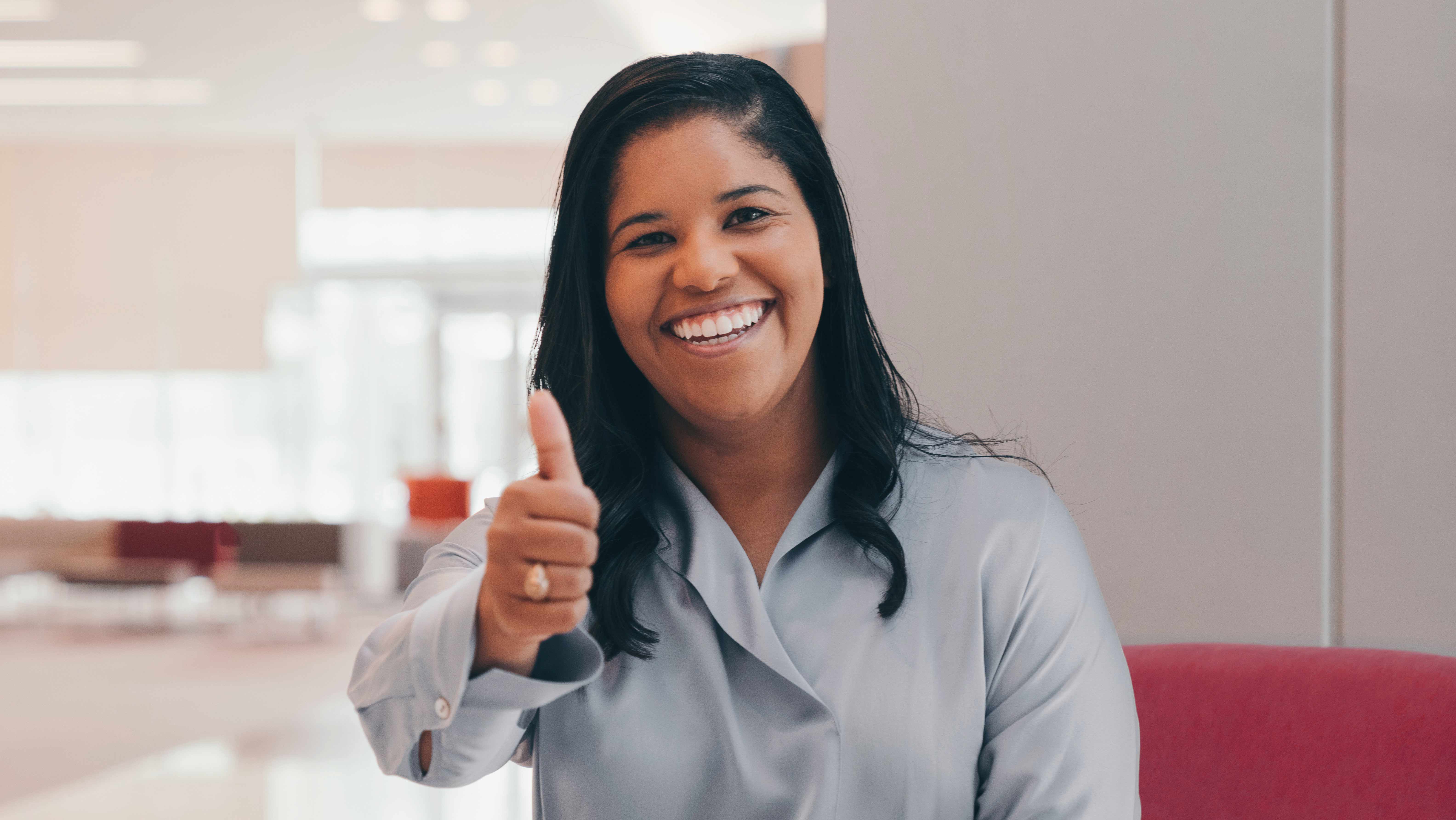 Woman with thumbs up.