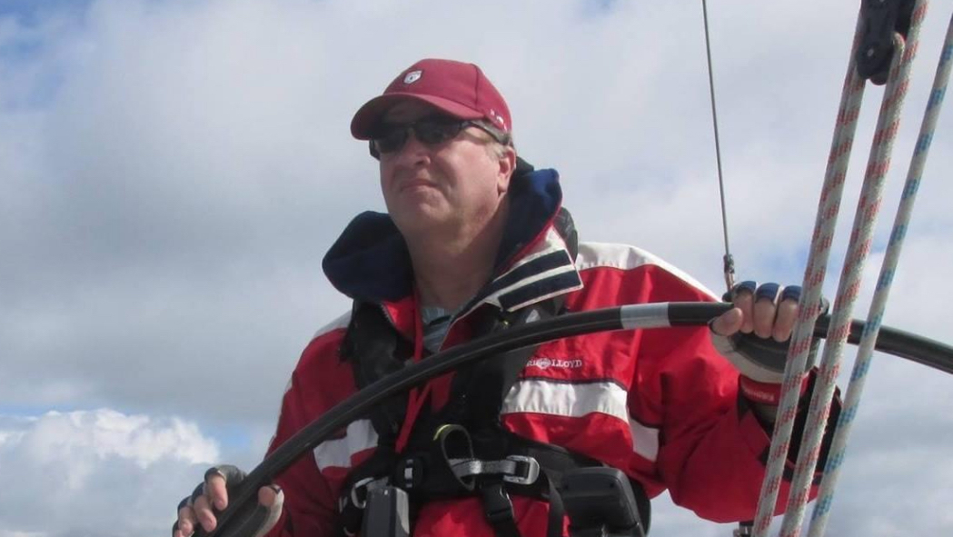 Man steering a boat.