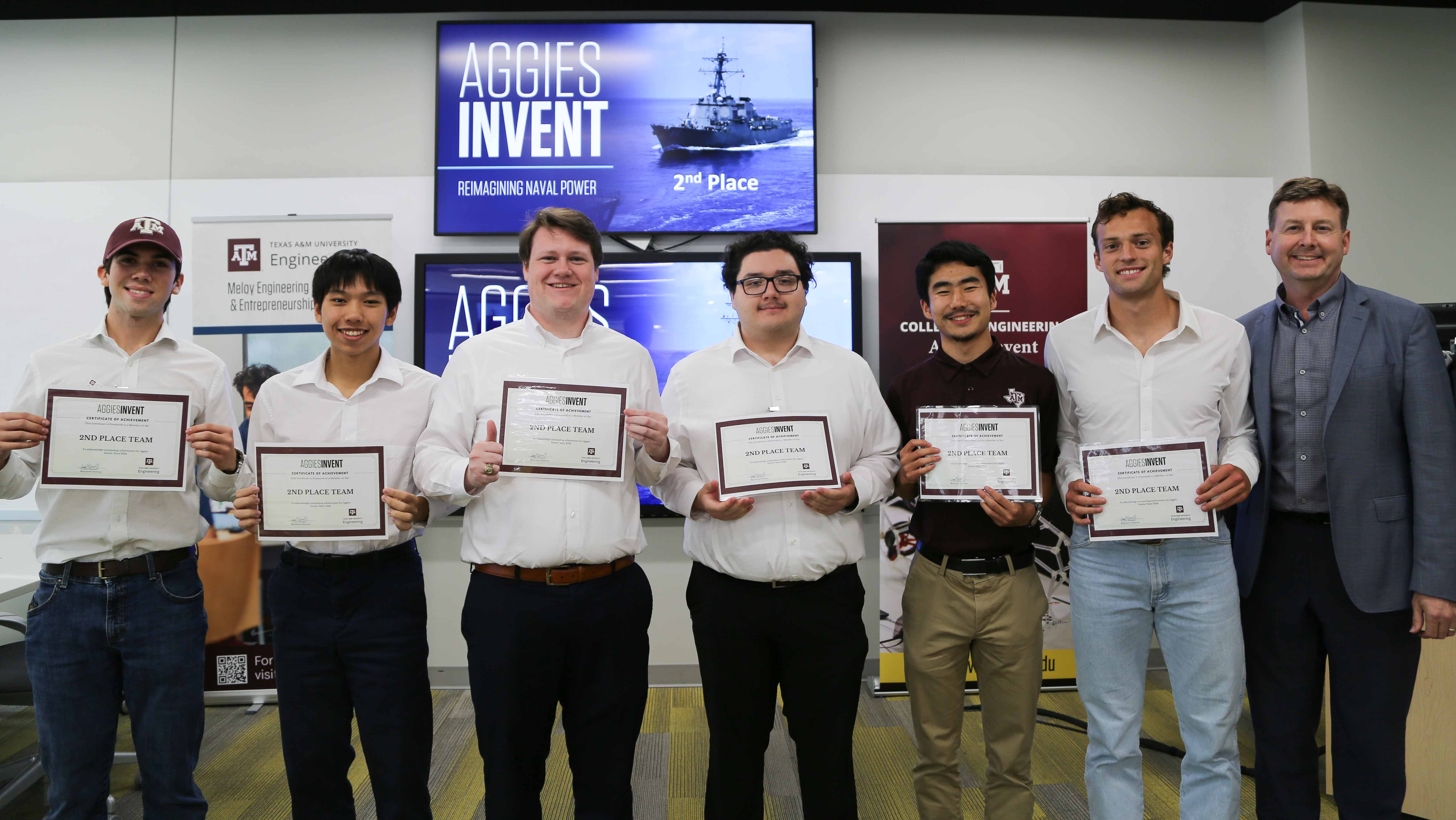 A group of men holding second-place certificates.