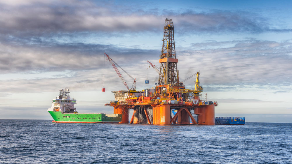 An offshore oil rig and a barge