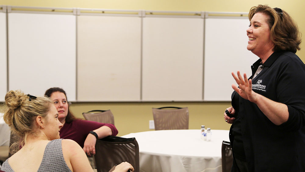 Shawna Fletcher, director, speaks to women engineers at seminar luncheon.