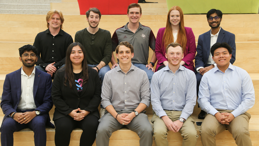 The 2023-2024 10 Meloy Fellows on the Learning Stairs in the Zachry Engineering Education Complex.